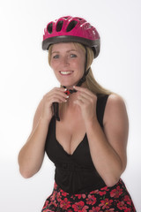 Female cyclist wearing a cycle helmet