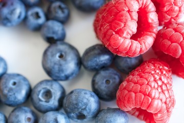 Raspberries and blueberries background 