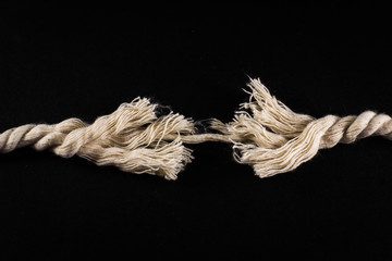 Frayed Rope and Thread on Black Background