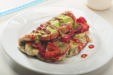 Waffle wrap with bananas, strawberries and chocolate
