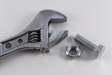 Silver Spanner Nut and Bolt on White