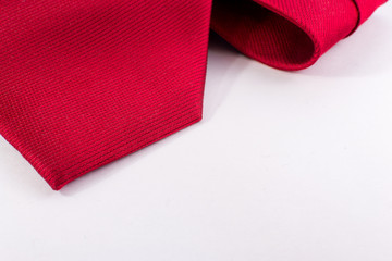 Closeup of Red Silk Tie on White Background