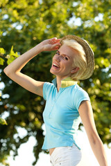 Beautiful young woman smiling with hat