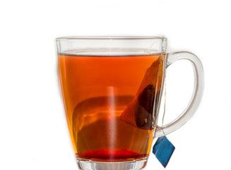 Transparent tea cup with tea and teabag