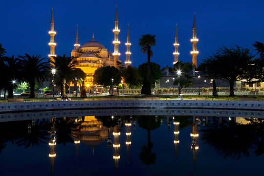 View of the Blue mosque and its reflection in the fountain at night, Istanbul