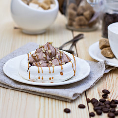 White meringues with brown chocolate stripes