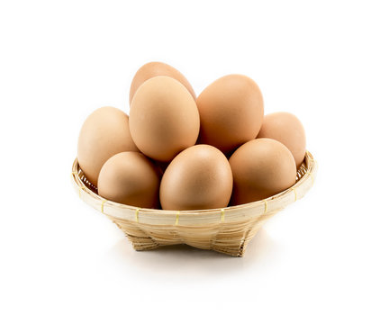eggs of hen in basket isolate on white background