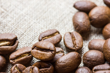 Coffee seed on linen fabric texture.