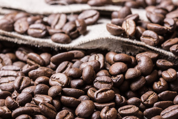 Coffee seed on linen fabric texture.