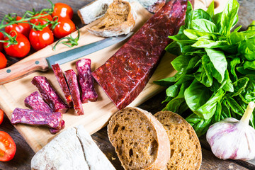 Armenian sudzhuk. Sausage, bread and cherry tomatoes