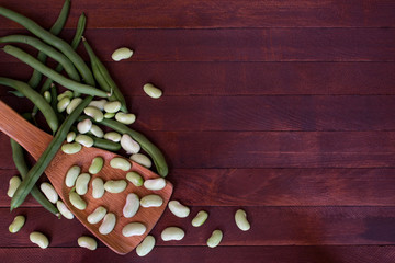 Fresh ripe Green beans heap on the wooden background