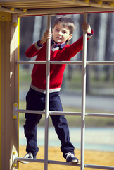 Obraz premium Portrait of a boy on a walk in the park
