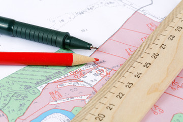 Topographic map of district with  ruler and a pencil