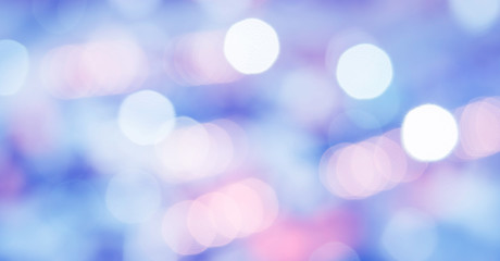 Abstract photo of backlight reflector and glitter bokeh lights background. Image is blurred and made with colorful filters.