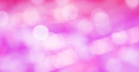 Abstract photo of backlight reflector and glitter bokeh lights background. Image is blurred and made with colorful filters.