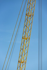 Detail crane jib against a blue sky