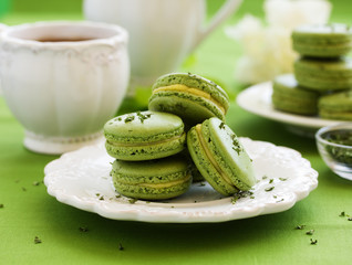 French cake with tea makarons match and tarragon. selective focus.