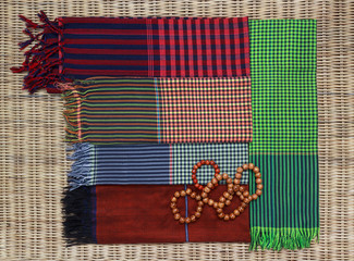 Fototapeta premium Colorful traditional khmer scarfs and beads