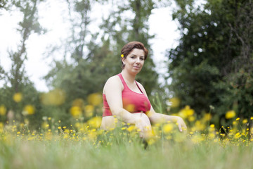 Pregnant woman relaxing outdoors