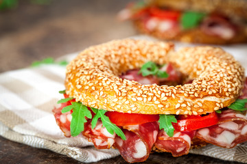 Bagel sandwich with pepperoni and tomato