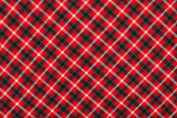 Scottish tartan pattern. Red, white and black plaid print as background. Symmetric rhombus square pattern.