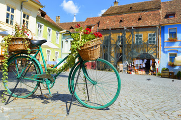 Decorative Old Bicycle Equipped with Basket in central square