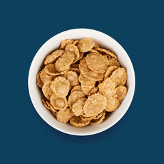 Multigrain flakes in small white plate