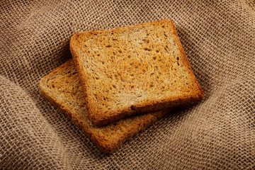 Two bread slices on the sack background