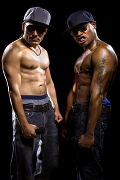 Rap concert with two muscular shirtless men with microphones