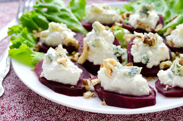 Beet Salad with goat cheese, walnuts, greens and herbs