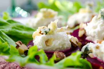 Beet Salad with goat cheese, walnuts, greens and herbs