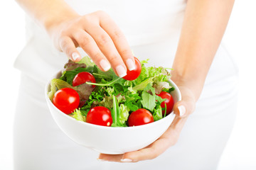 Salad bowl in woman hands