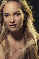 Fototapeta premium Studio portrait of a young beautiful woman. Cinematic Style.
