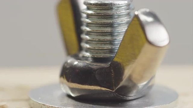 Hand Tightening a Wing Nut