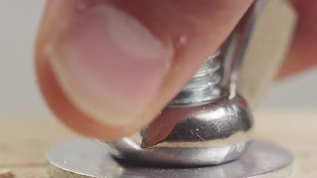 Hand Tightening a Wing Nut