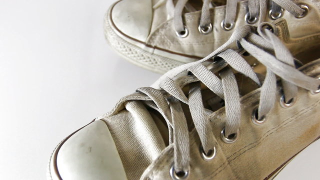 old sneakers on white background 