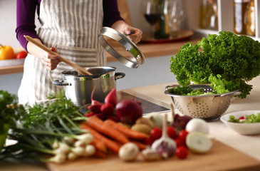 Cook's hands preparing vegetable salad - closeup shot