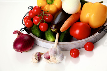 Composition with assorted raw organic vegetables wooden table