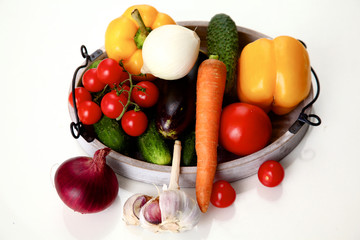 Composition with assorted raw organic vegetables wooden table