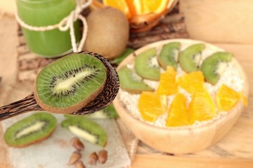 Fototapeta na wymiar Oat flakes with citrus fruit, kiwi fruit and kiwi juice.