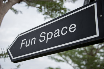 Fun space creative sign with tree as the background