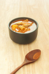 Spicy sour soup vegetable on wooden background