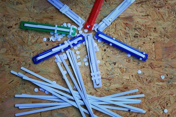 paper puncher and plastic tongue to the file