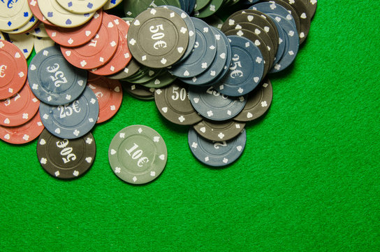 poker chips on green background