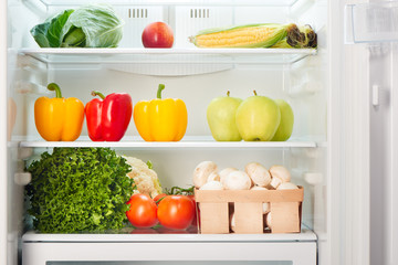 Open refrigerator full of fruits and vegetables. Weight loss diet concept.