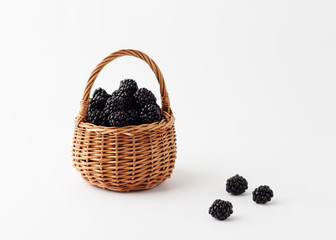 Blackberries in a basket. Isolated background.