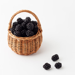 Fototapeta na wymiar Blackberries in a basket. Isolated background.