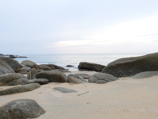 view of the beach, stone, sky and sea