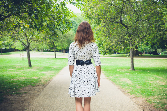 Young woman walking in park