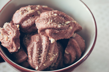 cocoa meringue cookie with peanut in bowl